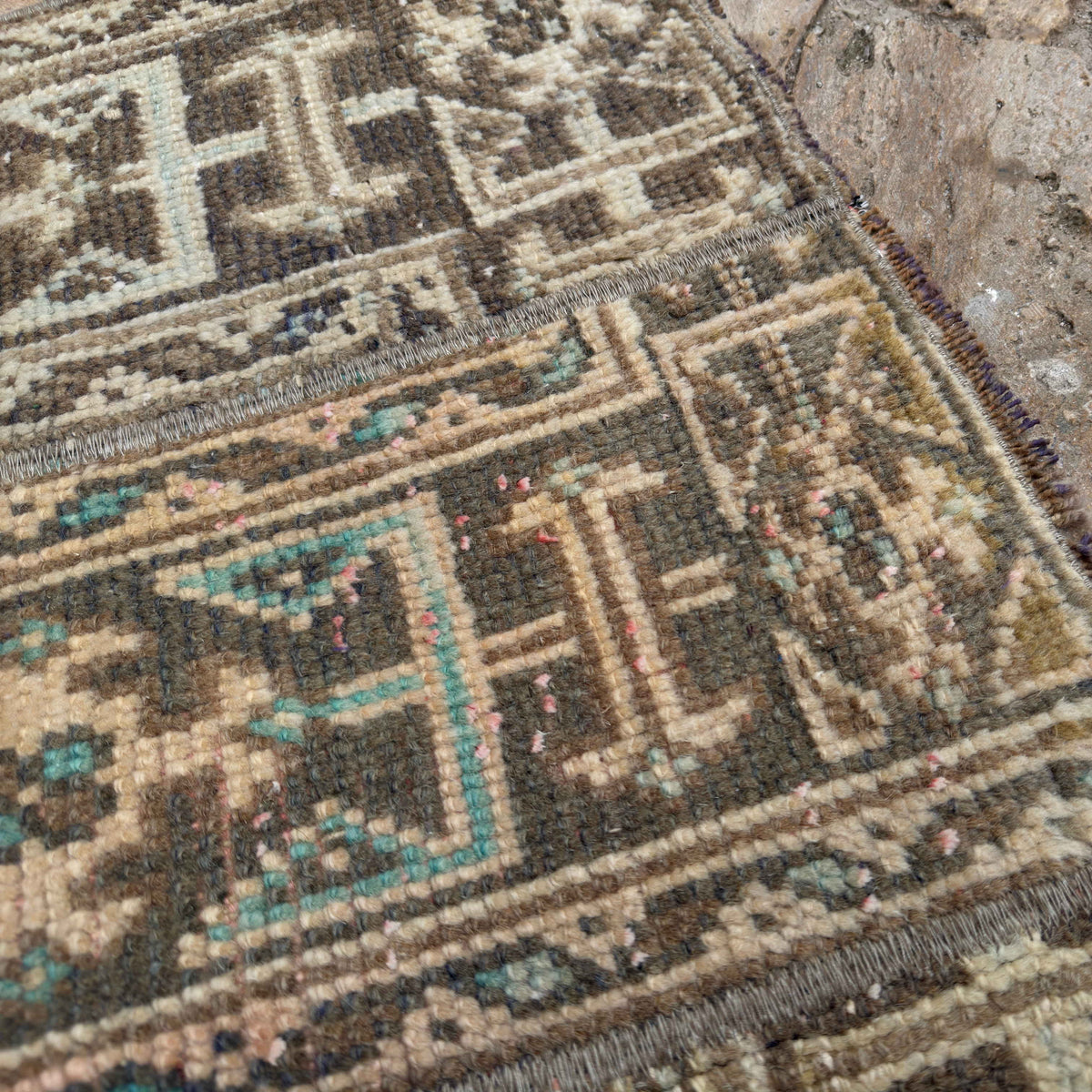 Close-up of the beige Turkish patchwork runner rug showing patchwork details, hand-knotted weave, wool and cotton and low pile.