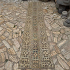 Beige 2' x 11' Turkish patchwork runner rug in wool and cotton, shown on the floor.