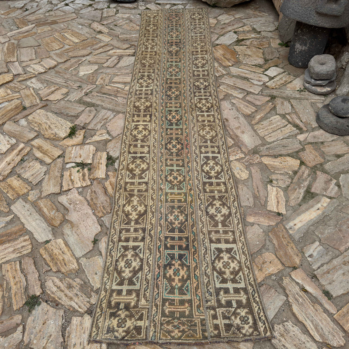 Beige 2' x 11' Turkish patchwork runner rug in wool and cotton, shown on the floor.