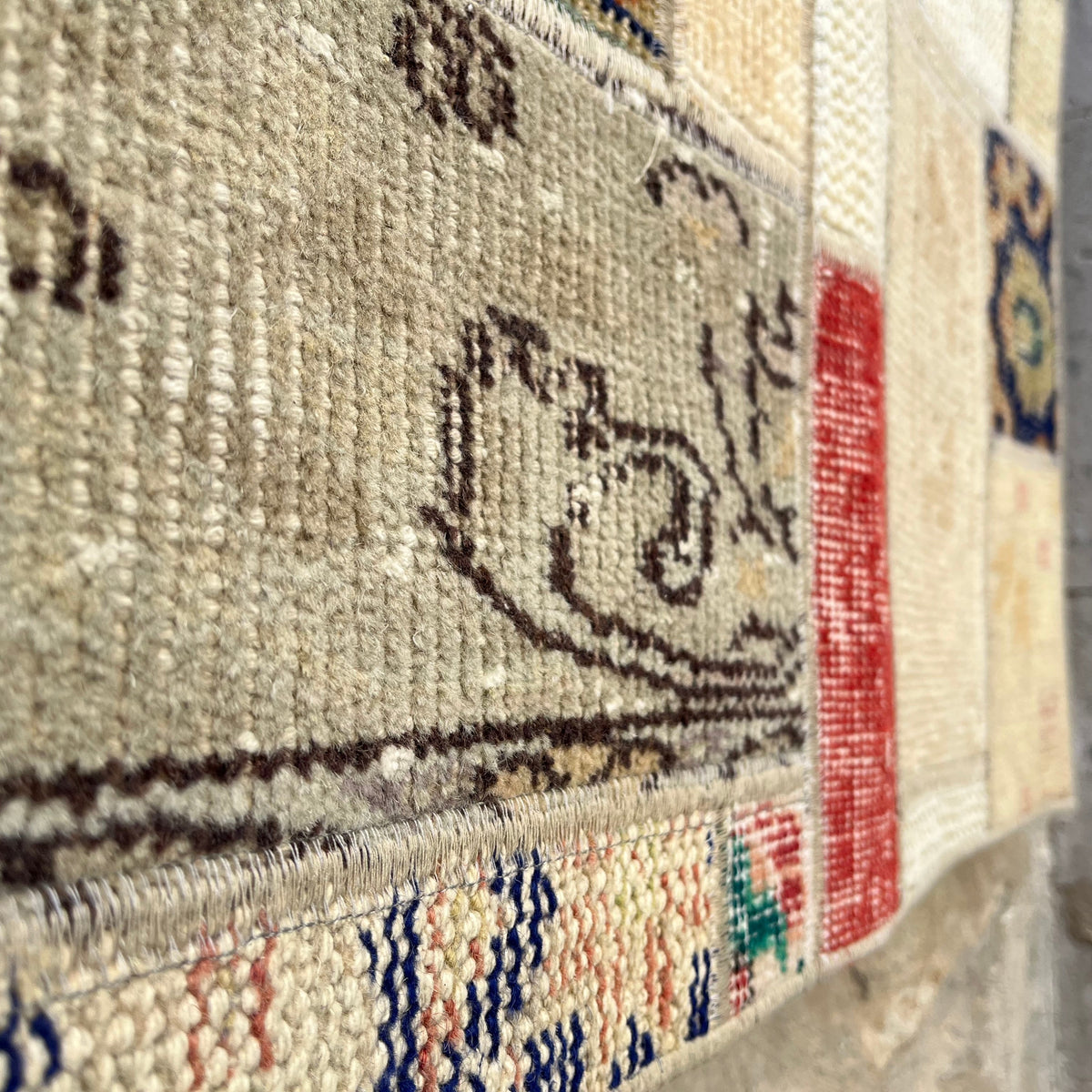 1970s beige Turkish patchwork runner rug with patchwork design, hand-knotted weave and low pile.