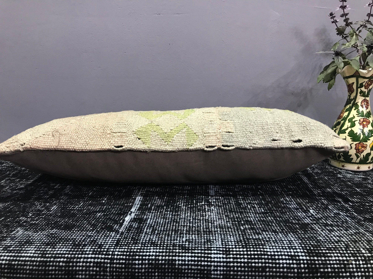 Beige Turkish pillow cover, shown on the floor.