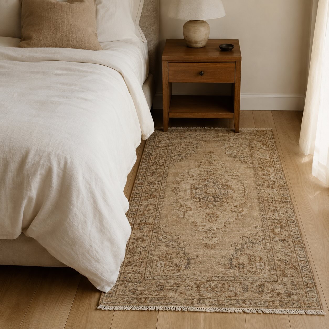 Soft beige vintage rug beside a bed, a calming rug color choice for bedrooms
Title (opsiyonel): Best rug colors for a bedroom