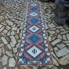 Pink 3' x 11' Turkish runner rug in wool and cotton, shown on the floor.
