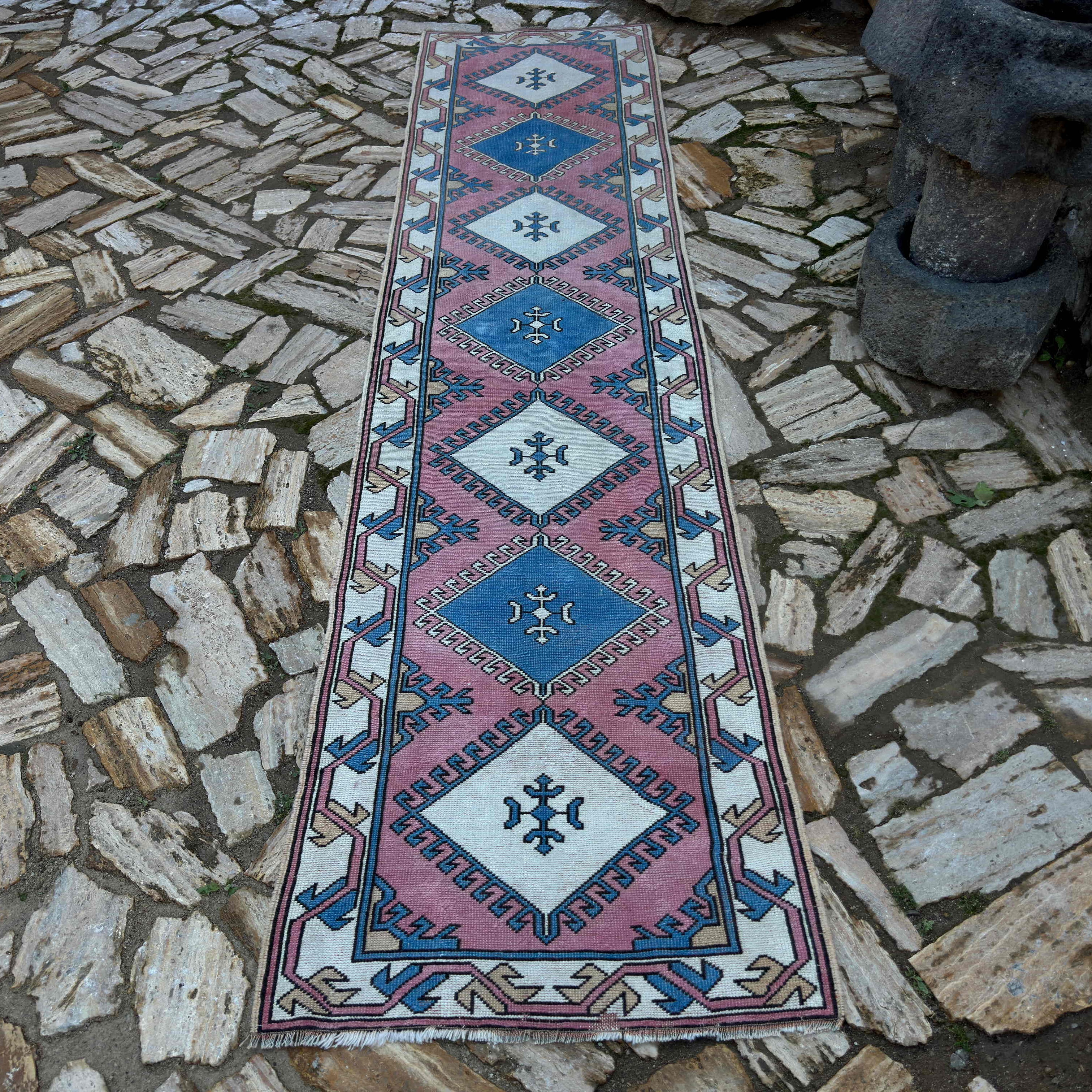 Pink 3' x 11' Turkish runner rug in wool and cotton, shown on the floor.