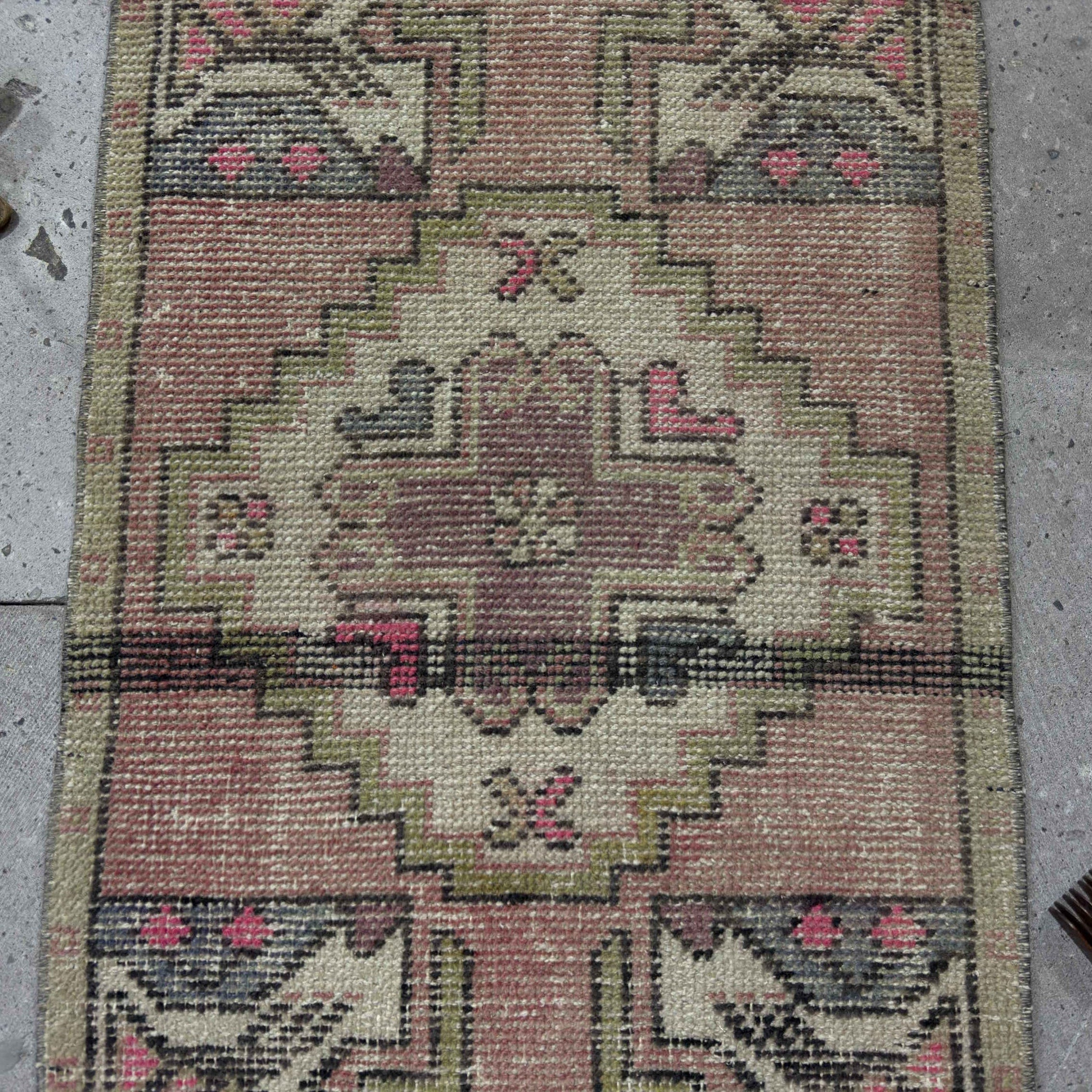 1970s pink Turkish small anatolian rug with traditional design, hand-knotted weave and low pile.