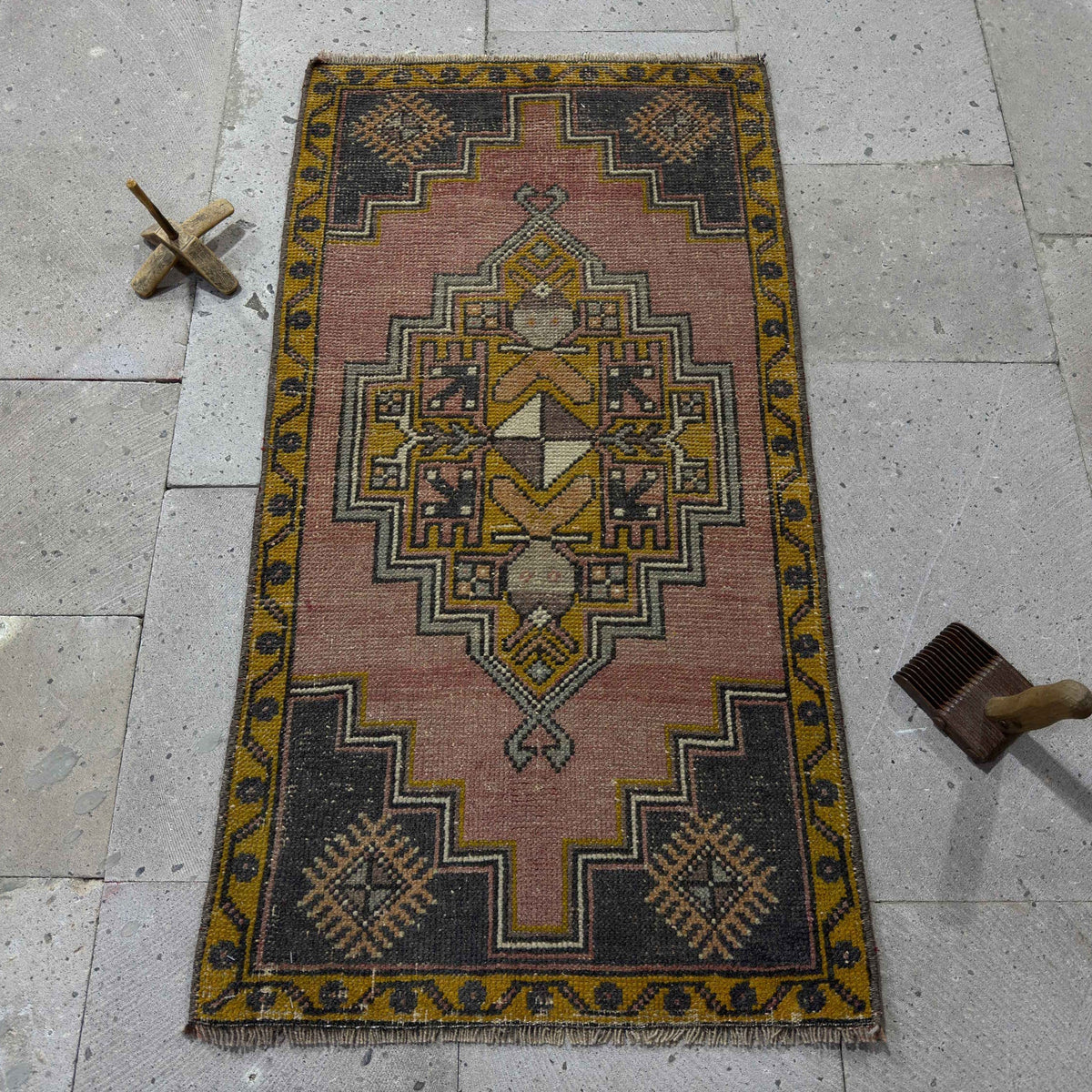 Red 2' x 3' Turkish small anatolian rug in wool and cotton, shown on the floor.