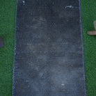 Close-up of the gray Turkish small overdyed rug showing overdyed details, hand-knotted weave, wool and cotton and low pile.
