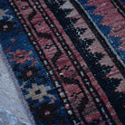 Red 3' x 6' small persian rug in wool and cotton, shown on the floor.