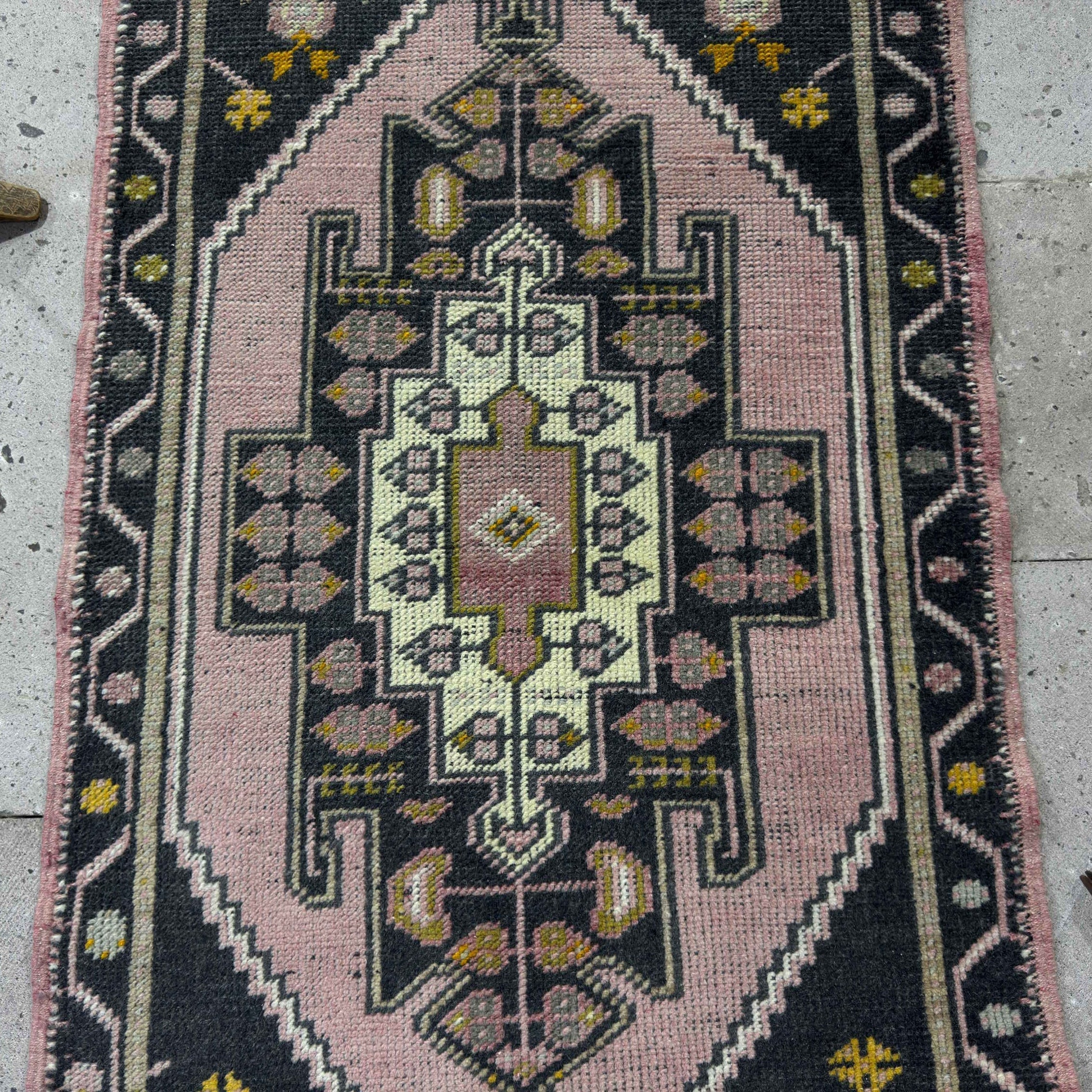 1970s pink Turkish small runner rug with traditional design, hand-knotted weave and low pile.