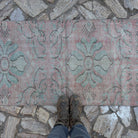 1970s pink Turkish small runner rug with traditional design, hand-knotted weave and low pile.