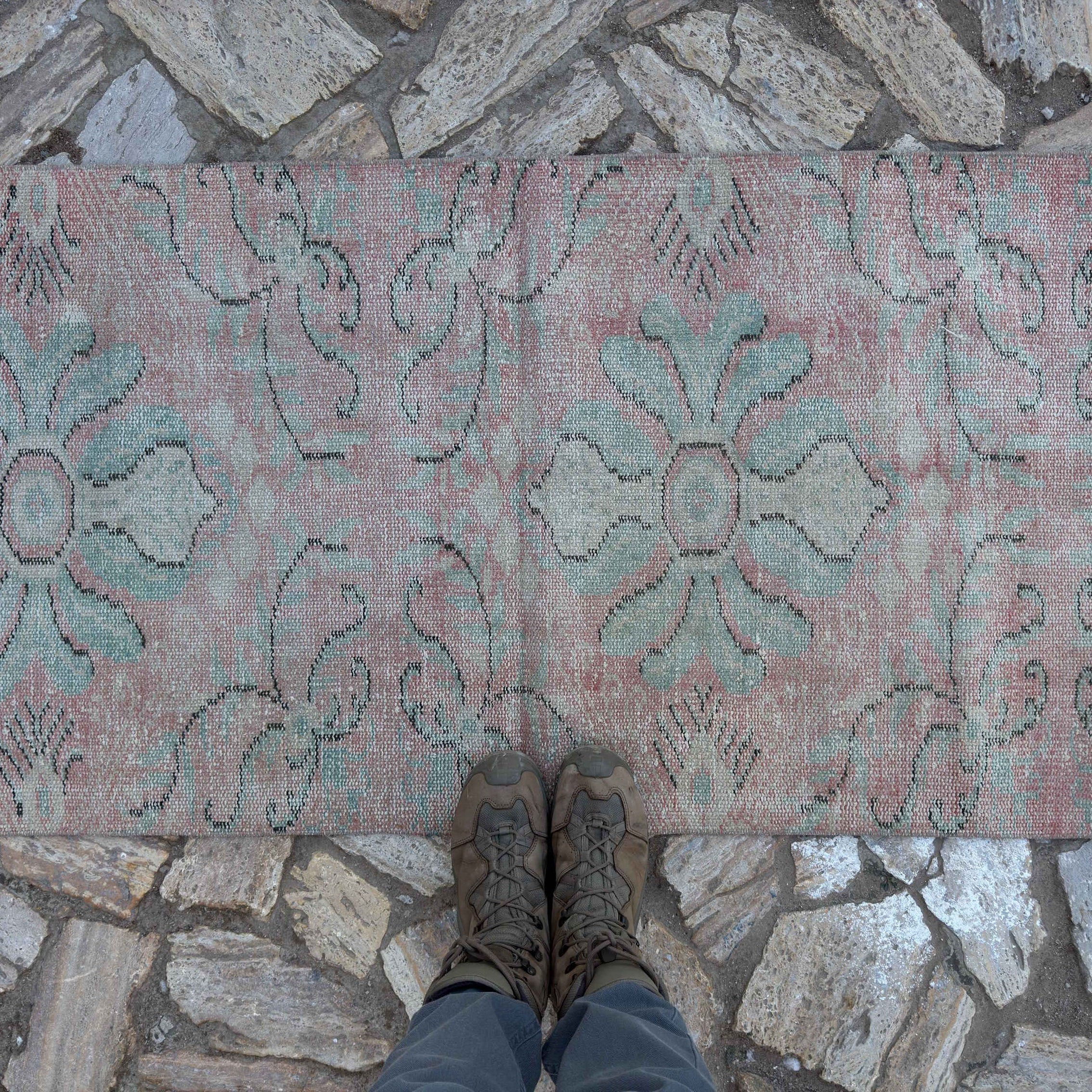 1970s pink Turkish small runner rug with traditional design, hand-knotted weave and low pile.