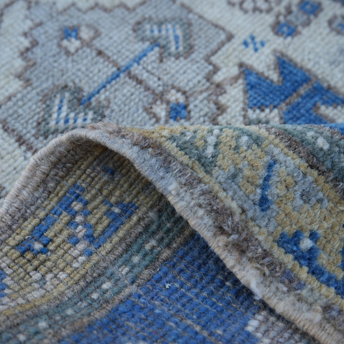 Additional view of the blue small turkish rug, hand-knotted in wool.