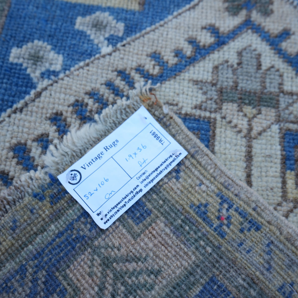 Blue 2' x 3' small turkish rug from the 1970s with traditional design.