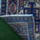 1970s blue small turkish rug with traditional design, hand-knotted weave and low pile.