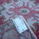 Red 2' x 3' small turkish rug from the 1970s with traditional design.