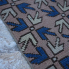 Pale Pink 2' x 5' small turkish rug in wool, shown on the floor.