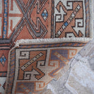1970s pale orange small turkish rug with traditional design, hand-knotted weave and low pile.