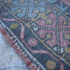 Pink 3' x 5' small turkish rug in wool, shown on the floor.