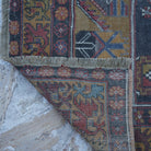 1970s red small turkish rug with traditional design, hand-knotted weave and low pile.