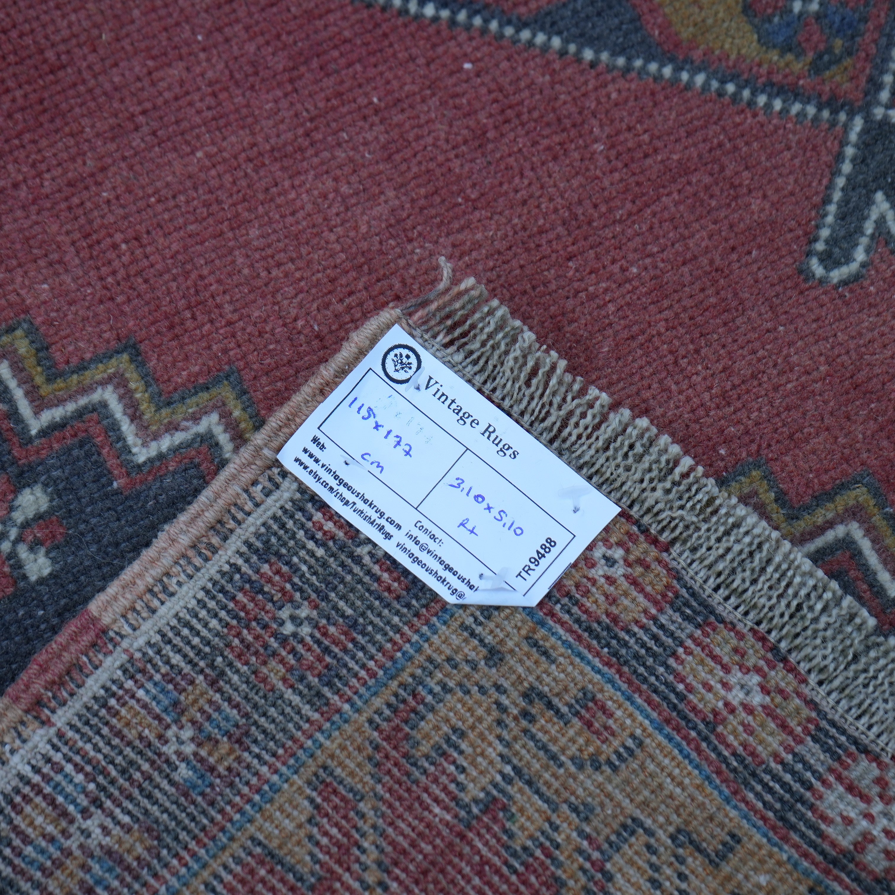 Red 4' x 6' small turkish rug from the 1970s with traditional design.