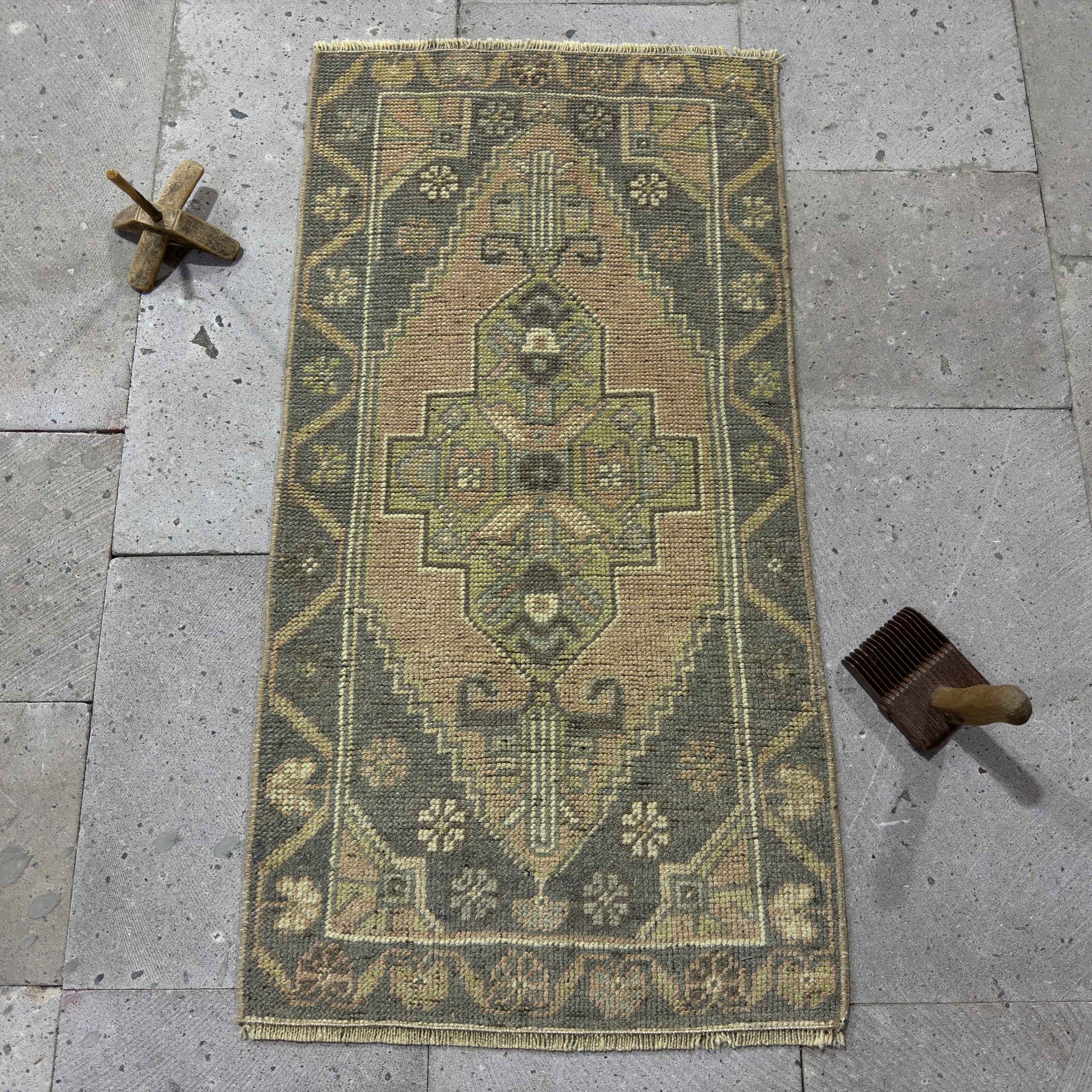 Gray 2' x 3' Turkish small vintage rug in wool and cotton, shown on the floor.