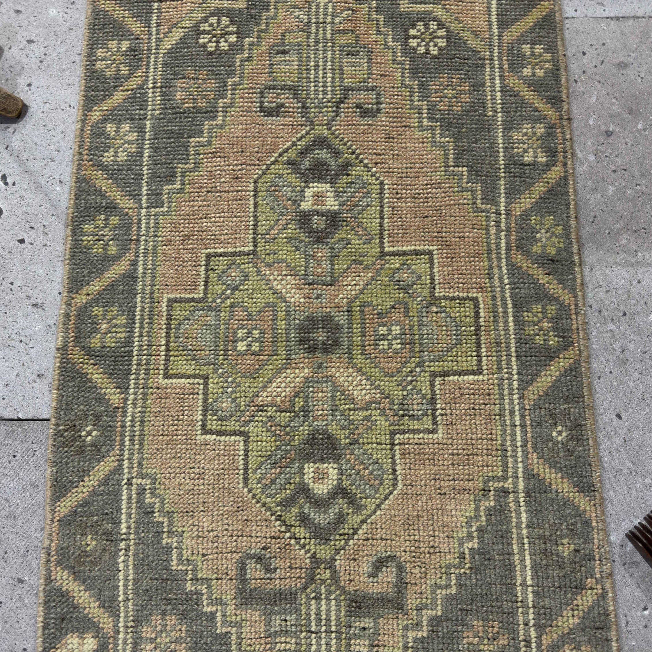 1970s gray Turkish small vintage rug with traditional design, hand-knotted weave and low pile.