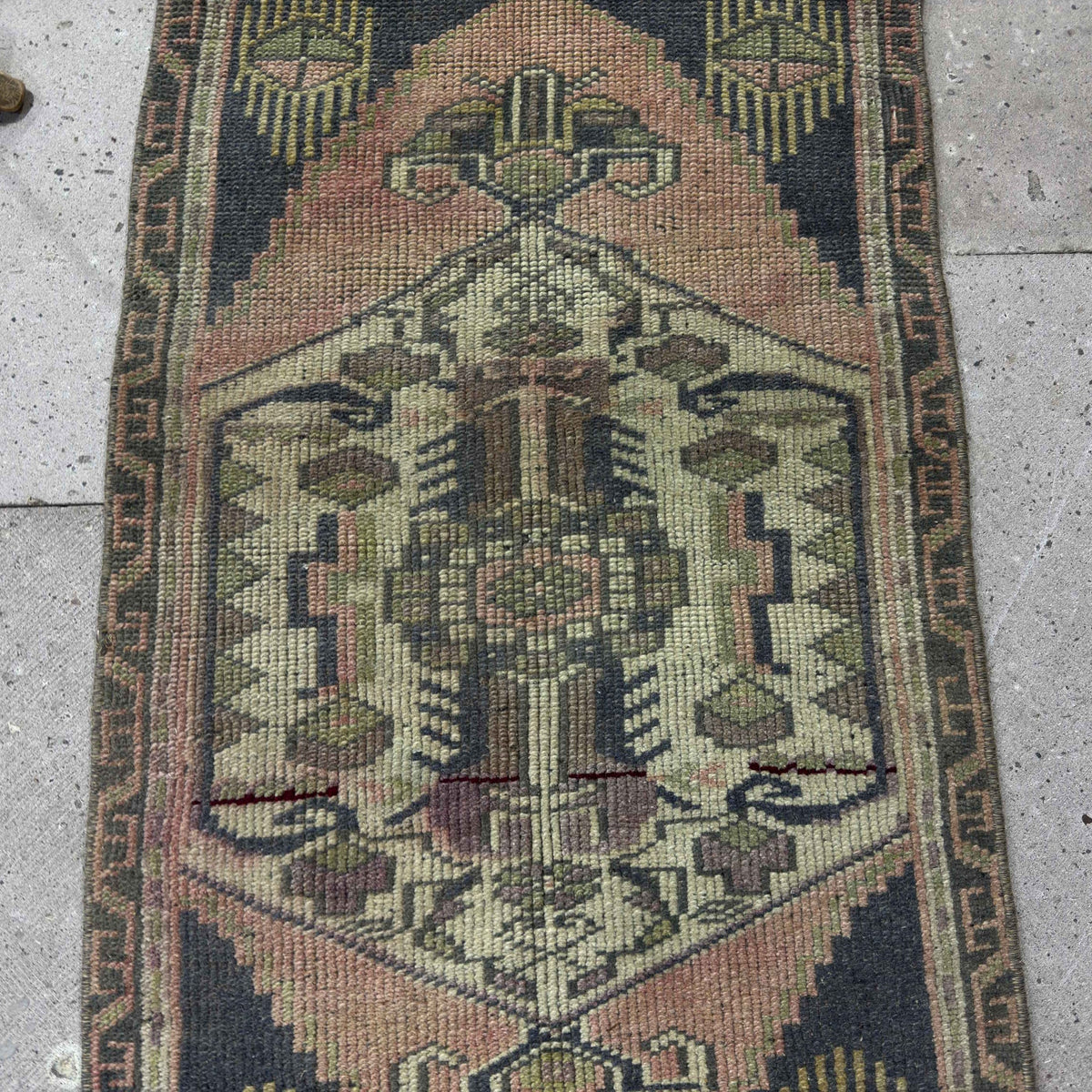 1970s navy blue Turkish small vintage rug with traditional design, hand-knotted weave and low pile.
