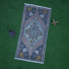 Pink 2' x 3' small vintage rug with traditional design, handmade in Turkey – Marigold.