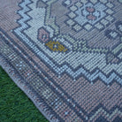 Pink 2' x 3' Turkish small vintage rug in wool and cotton, shown on the floor.