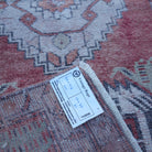 Red 2' x 3' Turkish small vintage rug from the 1970s with traditional design.