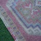 Red 2' x 3' Turkish small vintage rug in wool and cotton, shown on the floor.