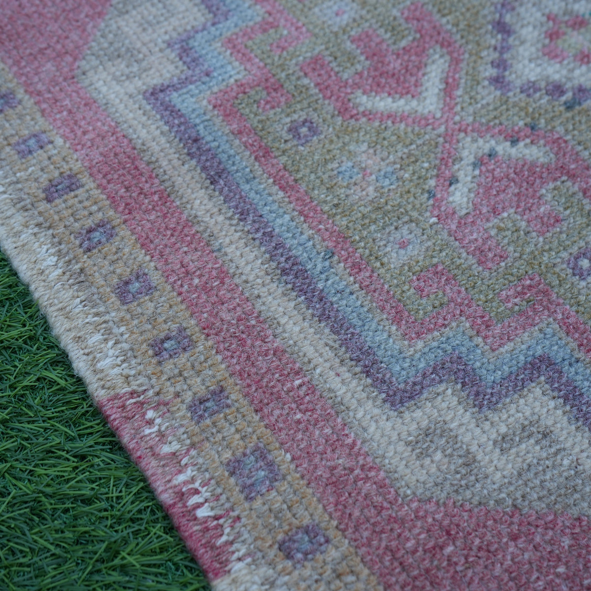 Red 2' x 3' Turkish small vintage rug in wool and cotton, shown on the floor.