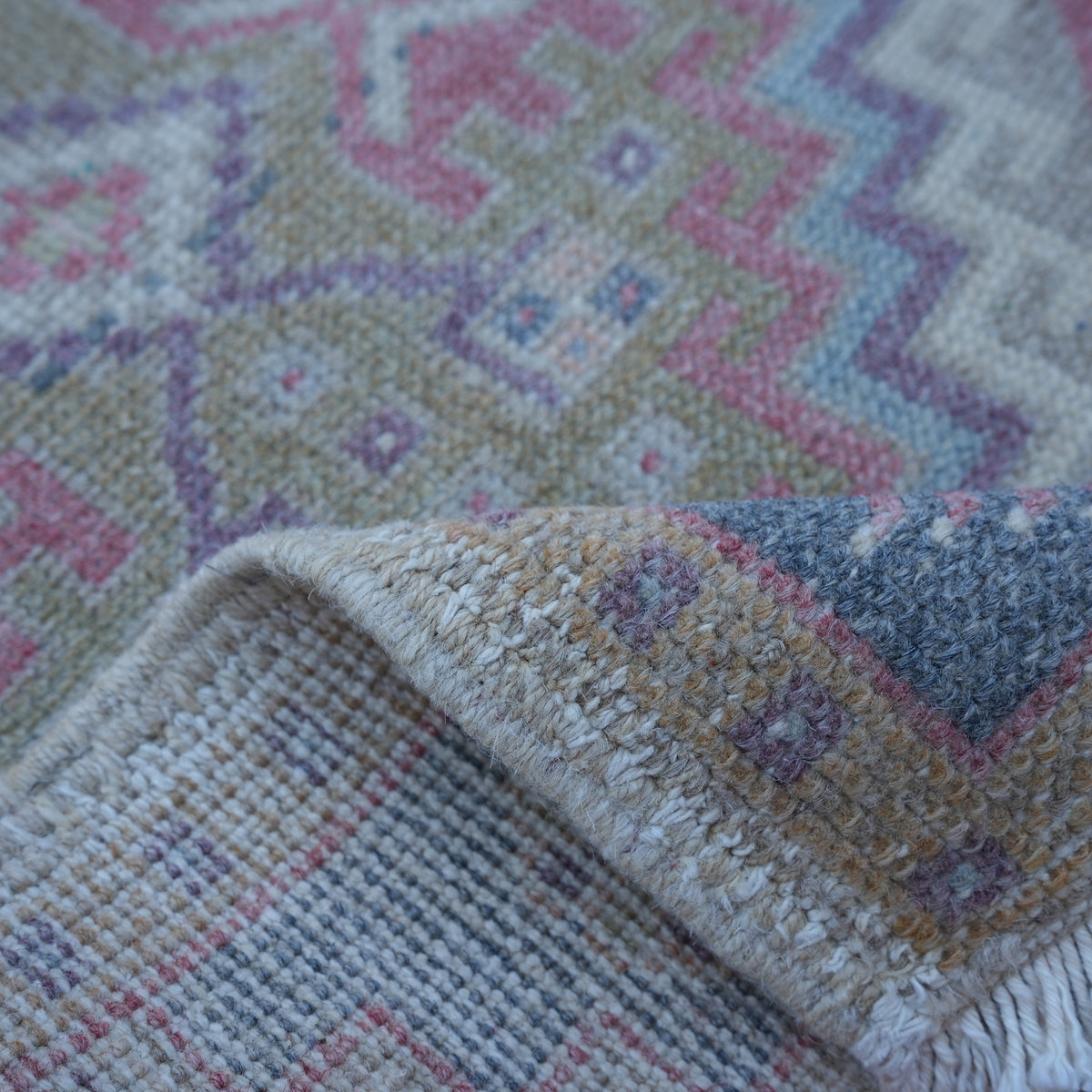 Additional view of the red Turkish small vintage rug, hand-knotted in wool and cotton.