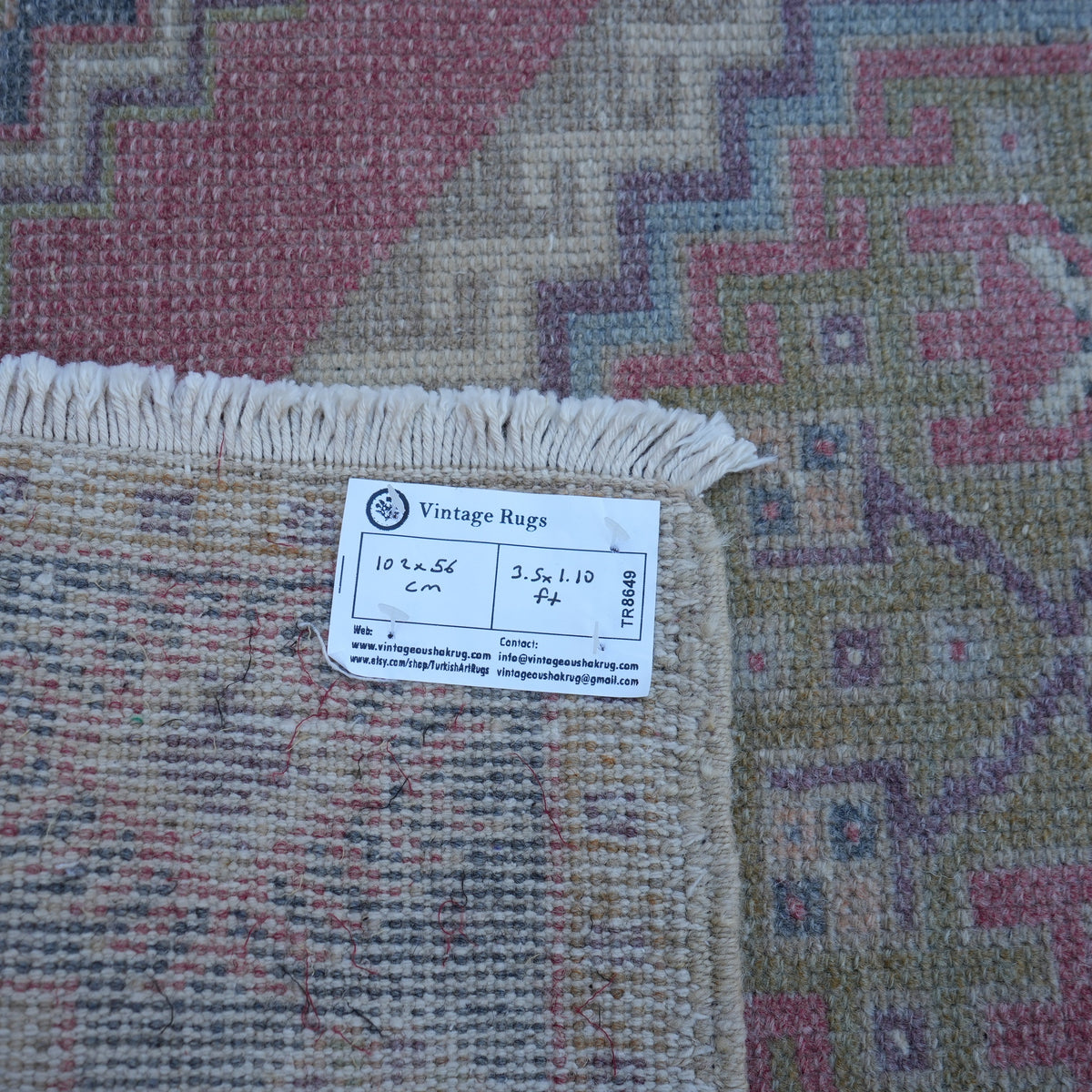 Red 2' x 3' Turkish small vintage rug from the 1970s with traditional design.