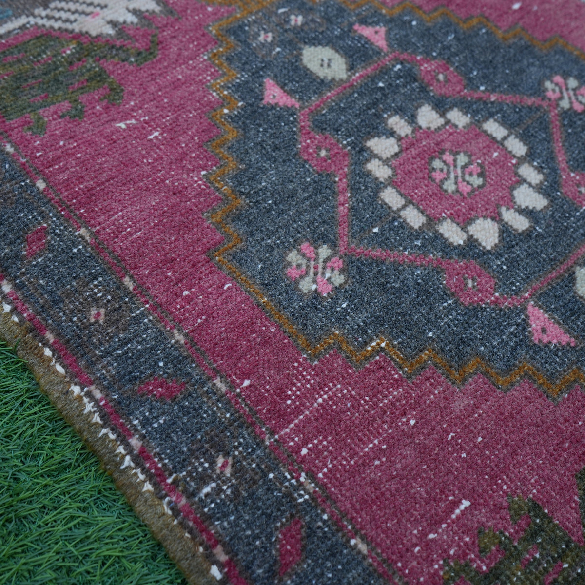 Red 2' x 3' Turkish small vintage rug in wool and cotton, shown on the floor.