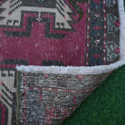 1970s red Turkish small vintage rug with traditional design, hand-knotted weave and low pile.
