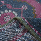 Additional view of the red Turkish small vintage rug, hand-knotted in wool and cotton.