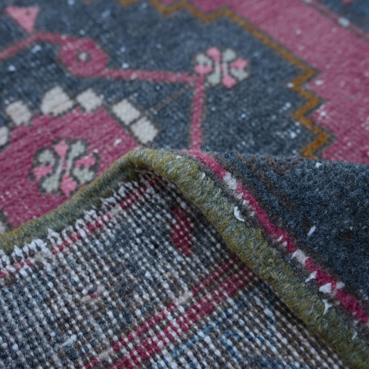 Additional view of the red Turkish small vintage rug, hand-knotted in wool and cotton.
