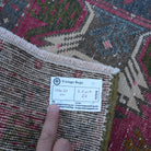 Red 2' x 3' Turkish small vintage rug from the 1970s with traditional design.