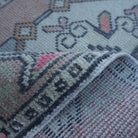 Additional view of the red Turkish small vintage rug, hand-knotted in wool and cotton.