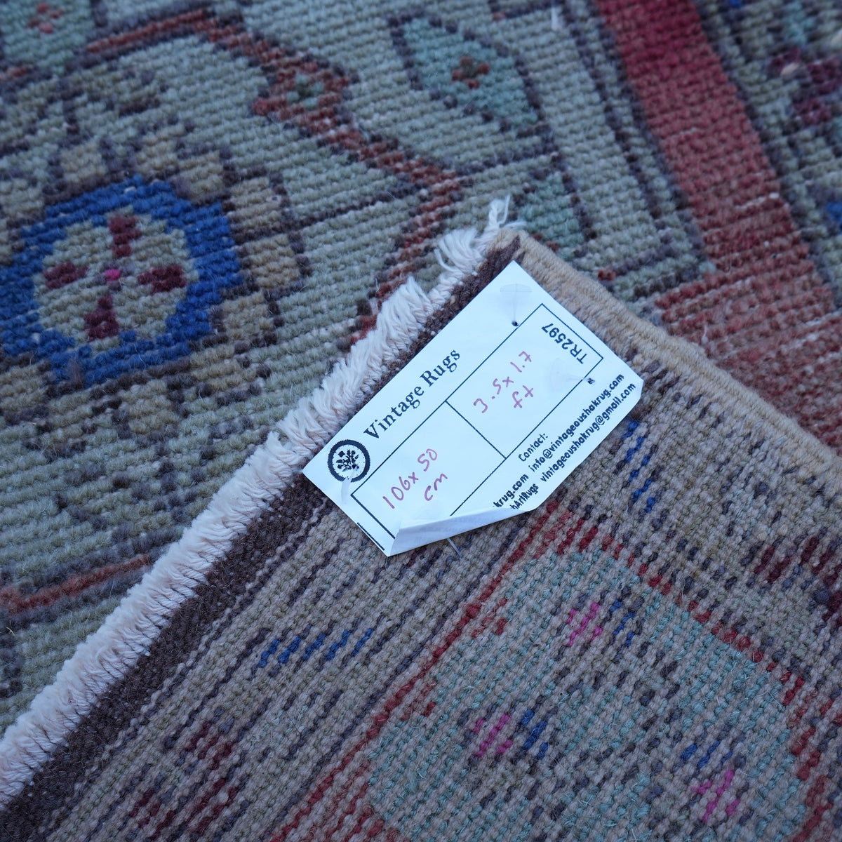 Red 2' x 3' Turkish small vintage rug from the 1970s with traditional design.