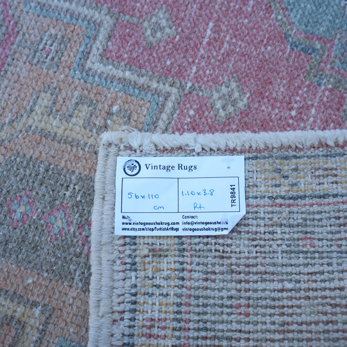 Pink 2' x 4' Turkish small vintage rug from the 1970s with traditional design.