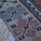 Pale Red 3' x 6' Turkish small vintage rug in wool and cotton, shown on the floor.
