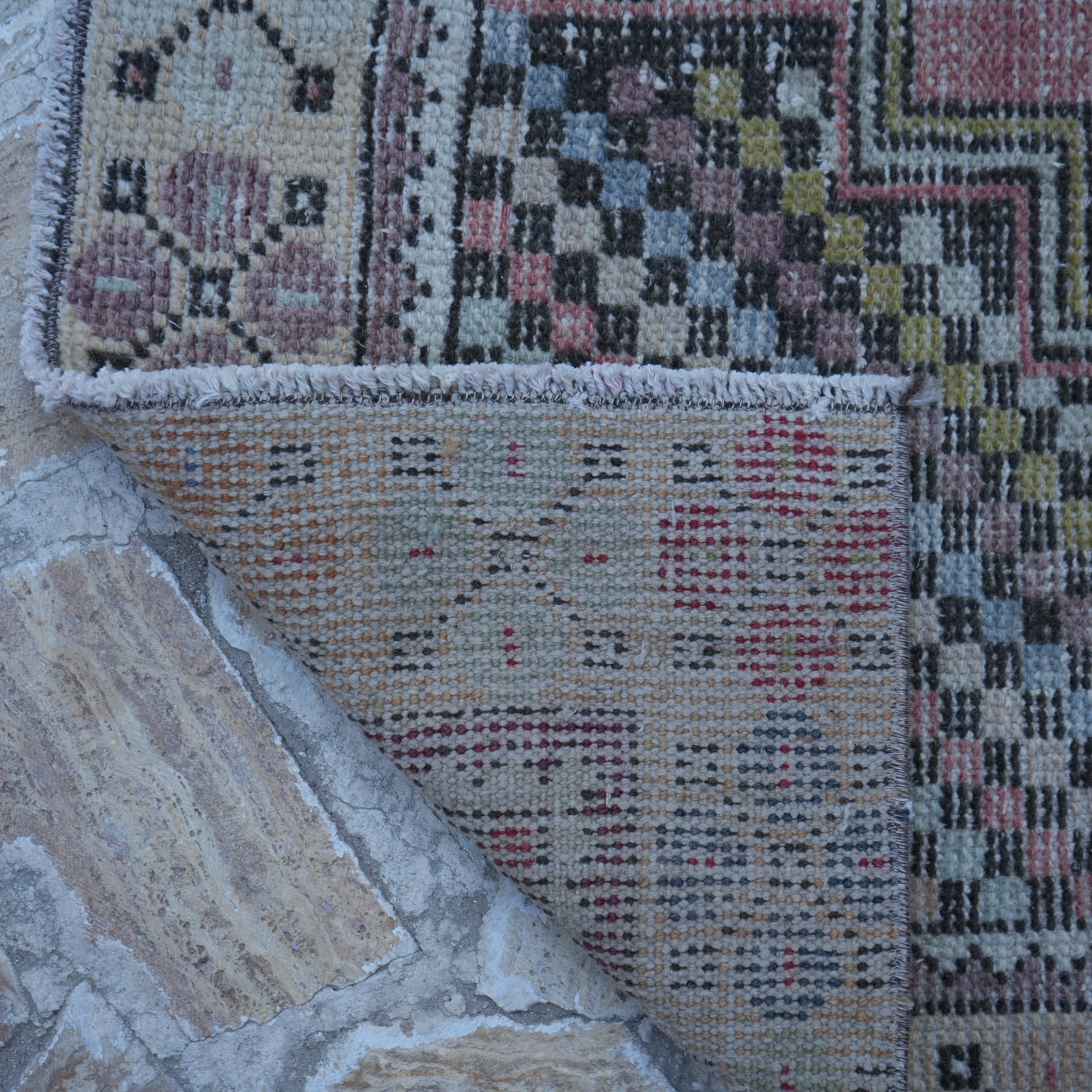 1970s pale red Turkish small vintage rug with traditional design, hand-knotted weave and low pile.