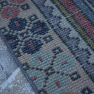 Red 3' x 6' Turkish small vintage rug in wool and cotton, shown on the floor.