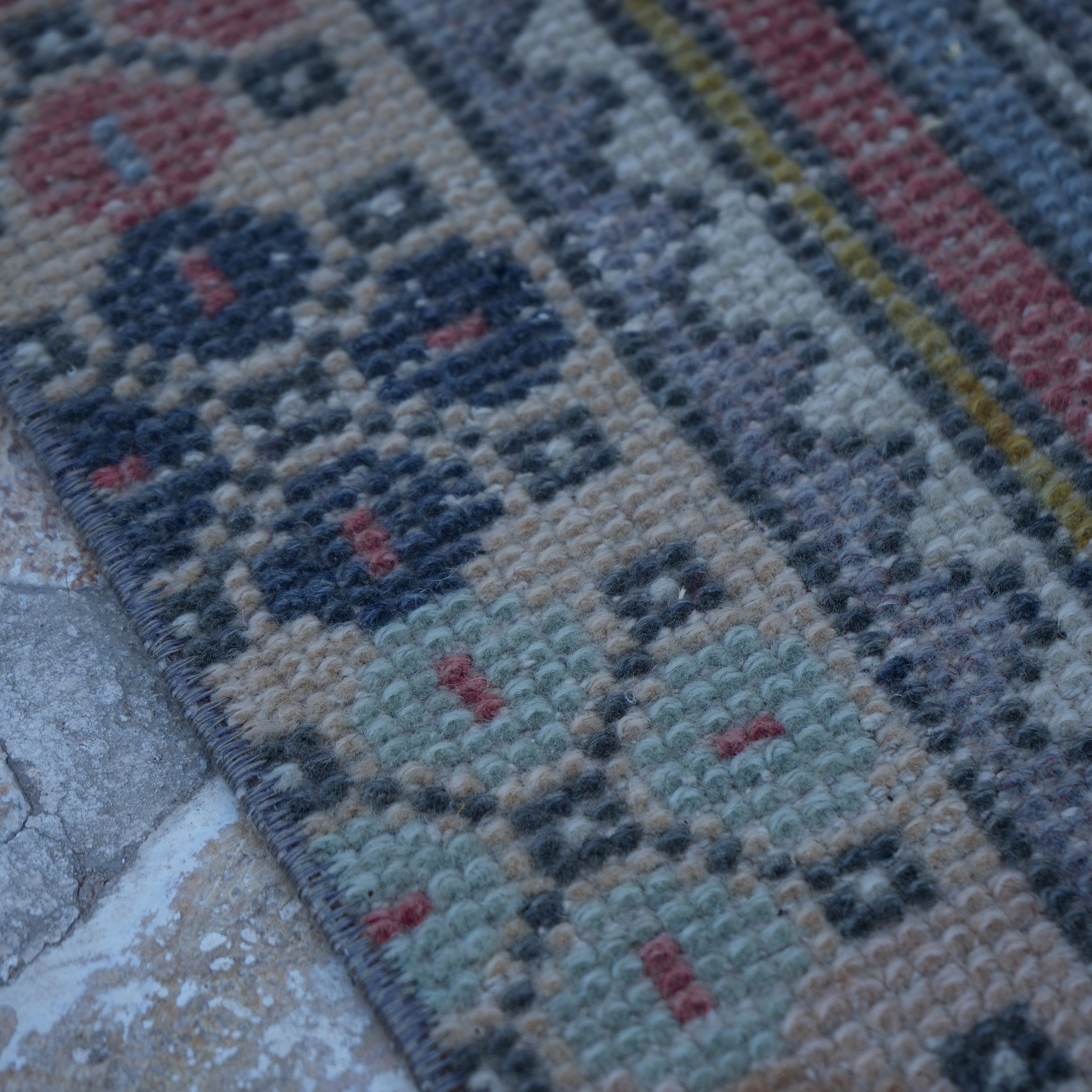 Red 3' x 6' Turkish small vintage rug in wool and cotton, shown on the floor.