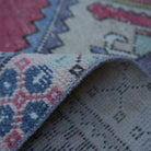 Additional view of the red Turkish small vintage rug, hand-knotted in wool and cotton.
