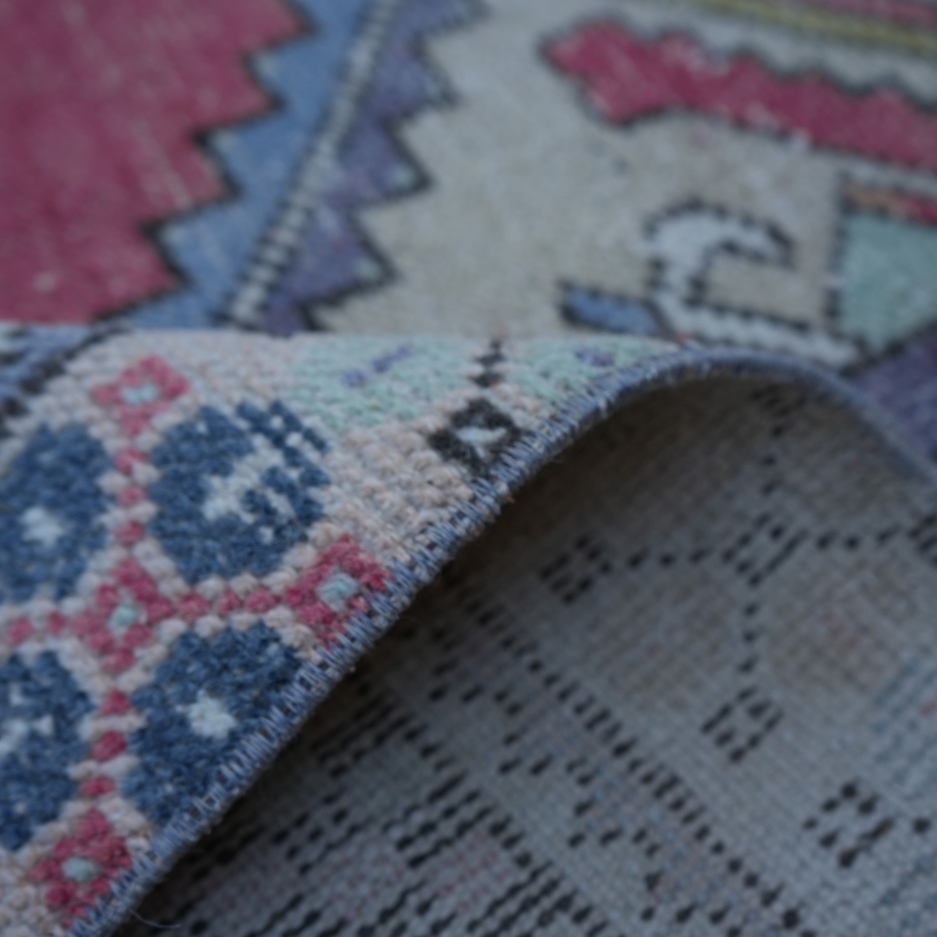 Additional view of the red Turkish small vintage rug, hand-knotted in wool and cotton.