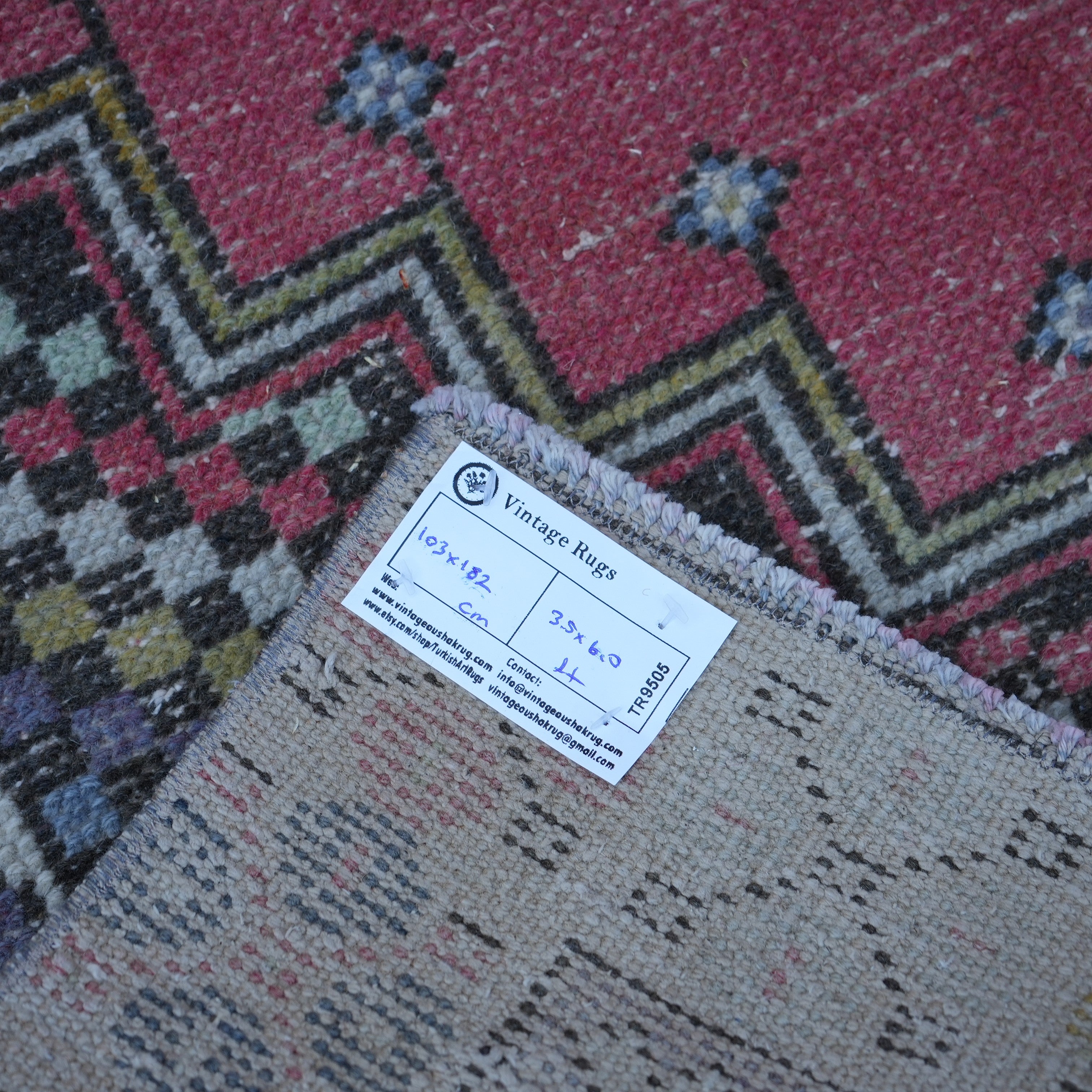 Red 3' x 6' Turkish small vintage rug from the 1970s with traditional design.