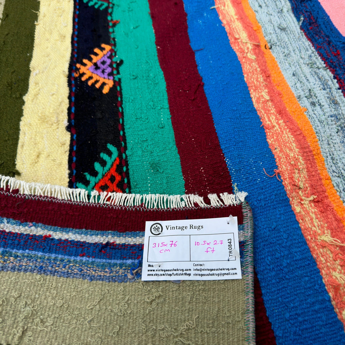 Close-up of the pink Turkish striped kilim runner rug showing striped details, flatweave construction, wool and cotton and low pile.